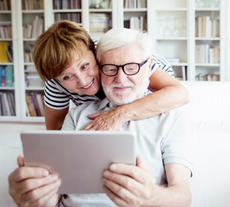 two people using a laptop